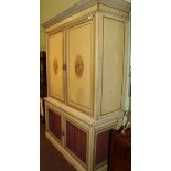 A late 19th/early 20th century wardrobe in the Neoclassical style, with painted oval panel doors,