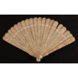 A circa 1840's Chinese carved ivory brisé fan, Qing Dynasty, the 19 inner sticks densely carved