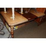 A late Victorian walnut extending dining table, with one additional leaf, 174cm extended