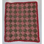 A Late 19th Century Log Cabin Quilt, worked only in red and white, brown and black creating lines of