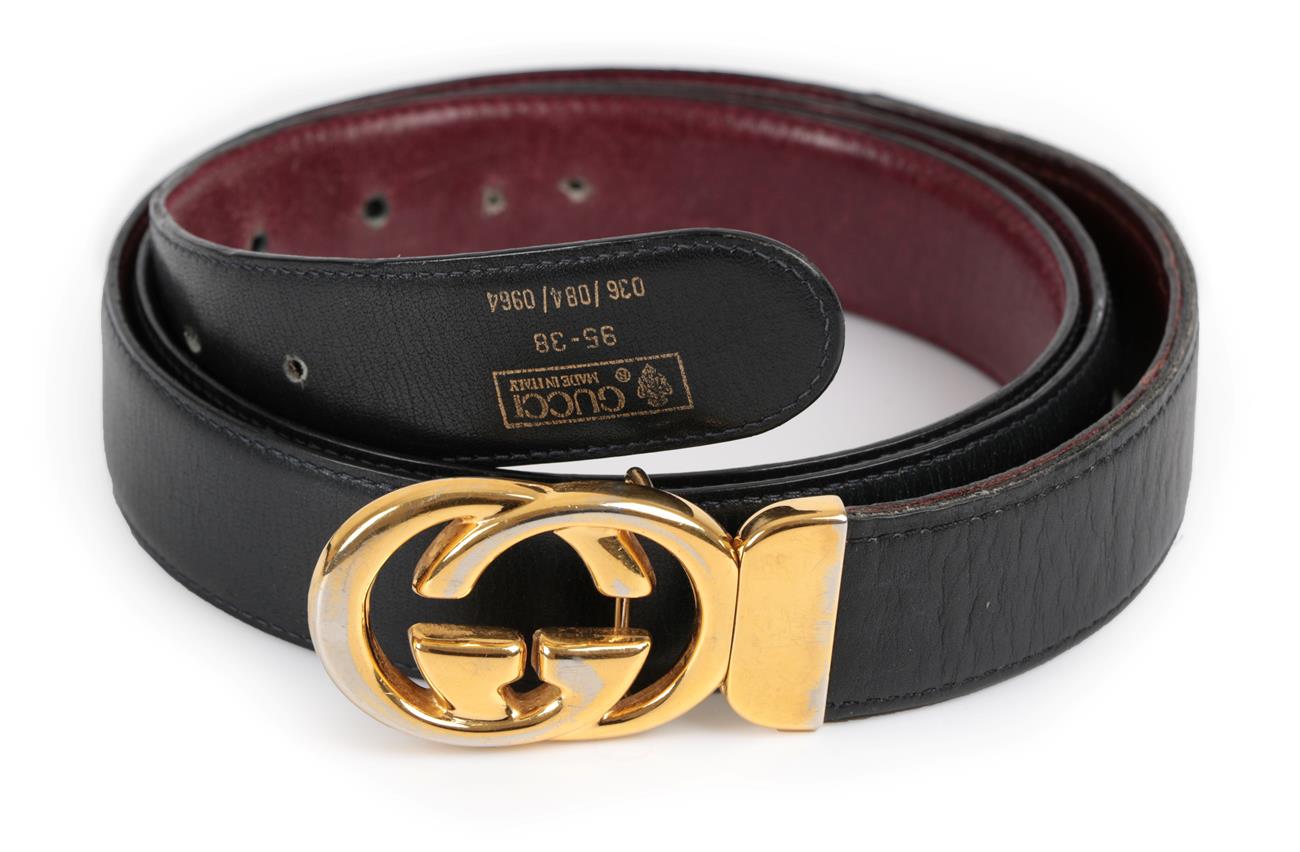 Gucci Black Leather Belt, with gilt metal 'GG' buckle, (stamped size 95-38). Buckle tarnished.