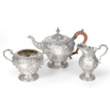 A Three-Piece George V Silver Tea-Service, by Charles Stuart Harris, London, 1912, each piece pear-