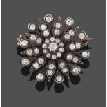 A Victorian Diamond Flowerhead Brooch, a cluster of old cut diamonds within alternating pointed