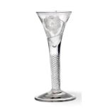 A Jacobite Wine Glass, circa 1750, the drawn trumpet bowl engraved with a rose and buds on a