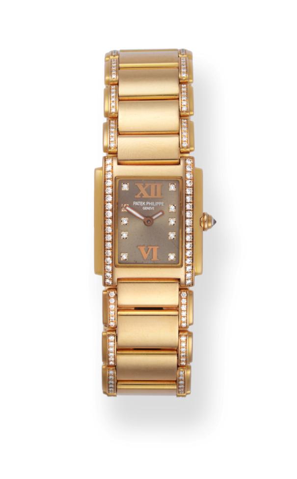 A Lady's 18ct Rose Gold Diamond Set Wristwatch, signed Patek Philippe, model: Twenty 4, ref: 4908/