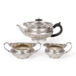 A Three-Piece Victorian Silver Tea-Service, by Walter and John Barnard, London, 1891 and 1892,