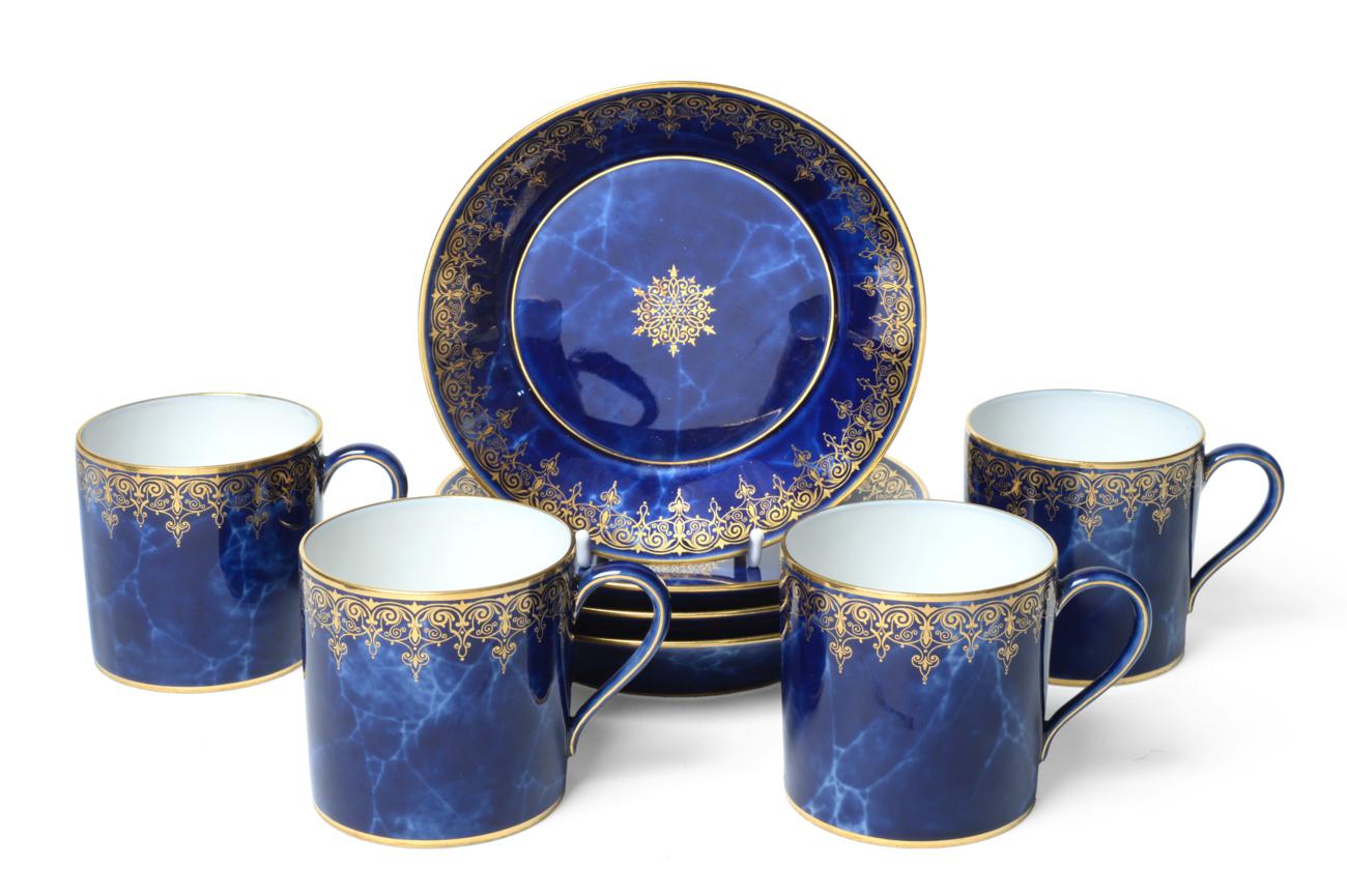A Set of Four Sèvres Porcelain Coffee Cans and Saucers, 19th century, gilt with foliate and