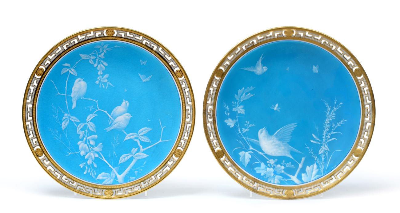 A Pair of Minton Plates, circa 1870, decorated with birds amongst branches on a sky