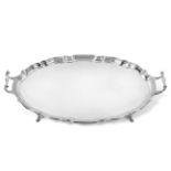 A George V Silver Tray, by Barker Brothers, Chester, 1919, shaped oval and on four pad feet, with