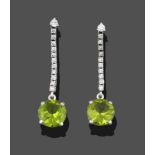 A Pair of Peridot and Diamond Drop Earrings, a round brilliant cut peridot suspended from an