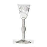 A Wine Glass, circa 1750, the rounded funnel bowl engraved with tulips, lily of the valley and a