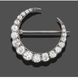 A Diamond Crescent Brooch, set throughout with graduated old cut diamonds in white claw settings,