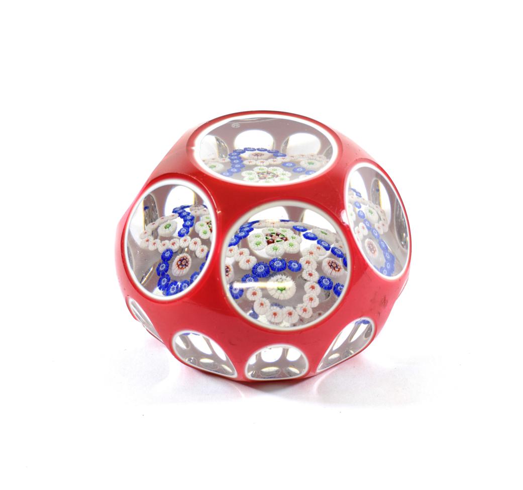 A Baccarat Red and White Double Overlay Millefiori Paperweight, circa 1850, with central cluster