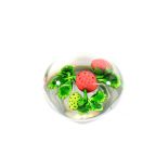 A Baccarat Strawberry Paperweight, circa 1850, set with one green and two ripe berries on a green