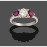 A Ruby and Diamond Three Stone Ring, a round brilliant cut diamond between two round cut rubies,