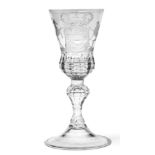 A Continental Wine Glass, probably Silesian, circa 1740, the thistle shaped bowl engraved with an