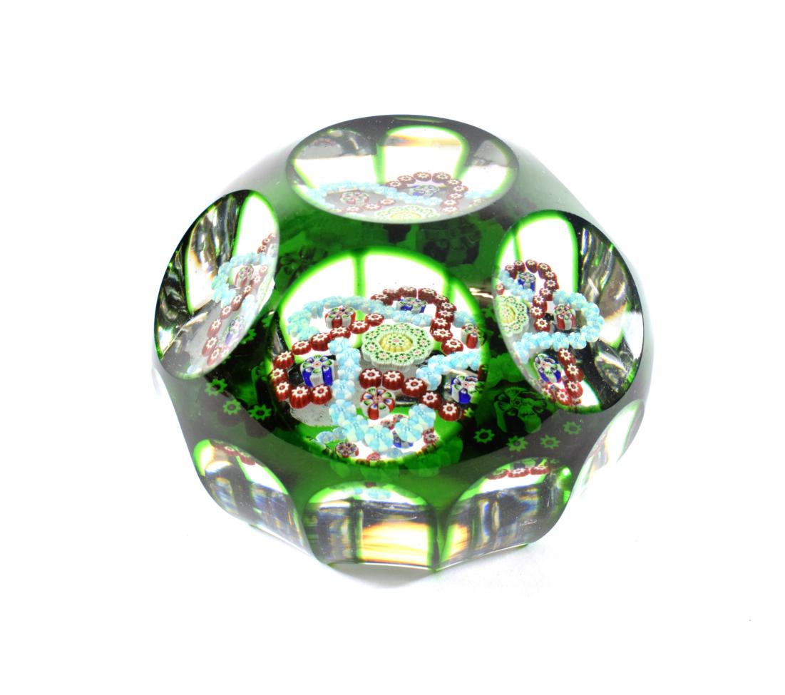 A Baccarat Faceted Translucent Green Overlay Garland Paperweight, circa 1850, set with two