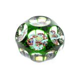 A Baccarat Faceted Translucent Green Overlay Garland Paperweight, circa 1850, set with two