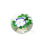 A Baccarat Anemone Paperweight, circa 1850, with six blue lined white petals and green stem and