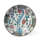 An Isnik Pottery Dish, circa 1620, typically painted in blue, green, black and red bole with