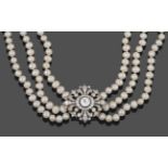 A Diamond Brooch, circa 1900, with later pearl choker, the lozenge shaped diamond set brooch with an