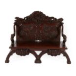 A Japanese Carved Hardwood Bench, late 19th/early 20th century, the back support profusely