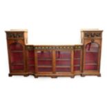 A Victorian Figured Walnut and Gilt Metal Mounted Display Cabinet, circa 1870, in three sections,