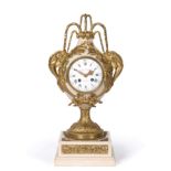 A French Alabaster and Gilt Metal Mounted Striking Mantel Clock, early 20th century, urn shaped case