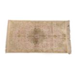 Finely Knotted Ghom Silk Rug Central Iran, modern The ivory field centred by a flowerhead