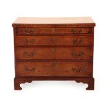A Burr Walnut, Crossbanded and Tulipwood Banded Straight Front Bachelor's Chest, the hinged lid