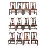 A Set of Six Mid 18th Century Oak Country Dining Chairs, with pierced splats above solid seats and