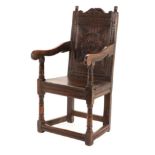 A 17th Century English Joined Oak Armchair, probably North Country, with turned finials above a