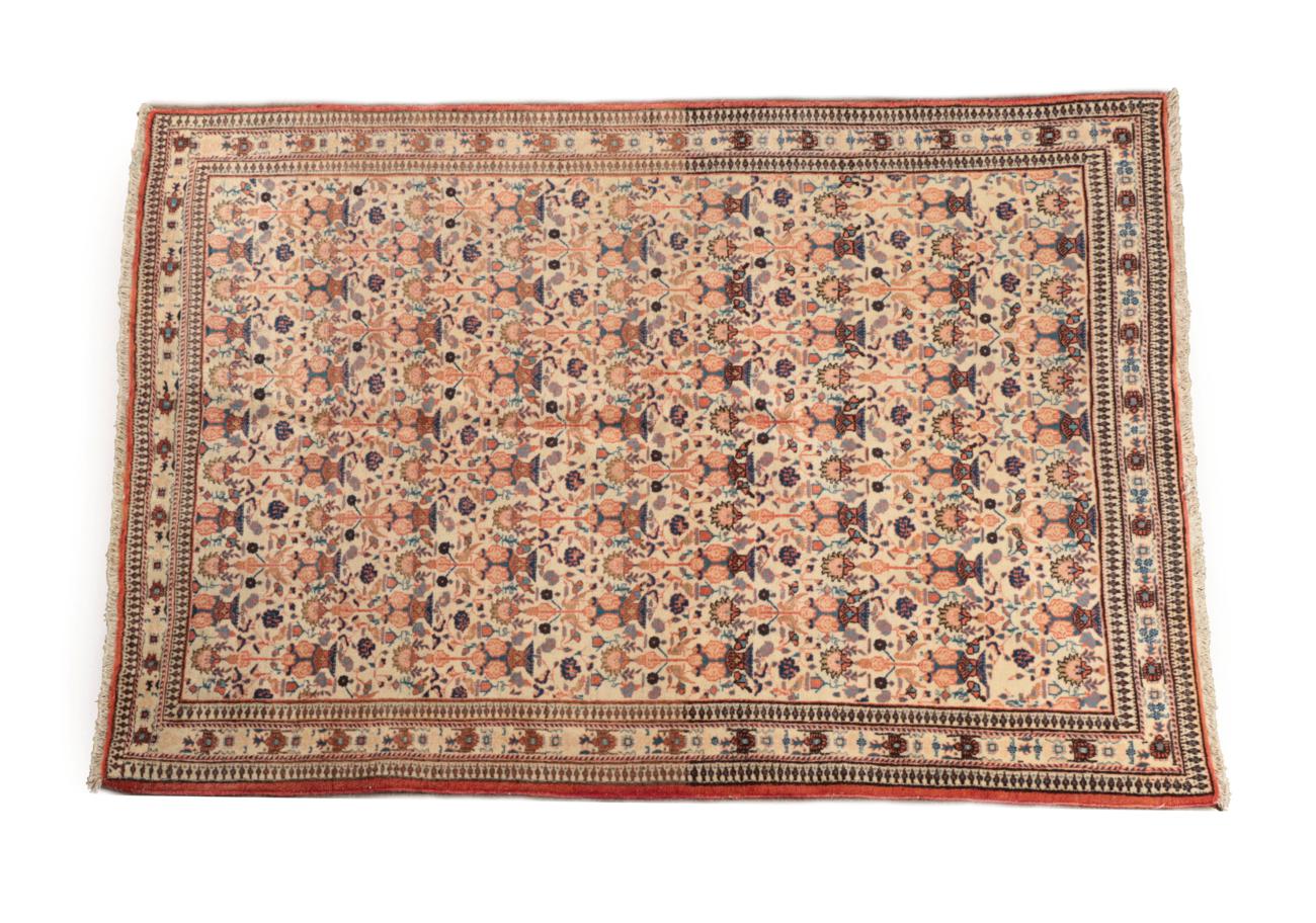 Veramin Rug of unusual size Central Iran, circa 1940 The cream field with rows of urns issuing