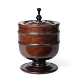 A Lignum Vitae Wassail Bowl and Cover, circa 1680, the ring turned cover with baluster finial, on