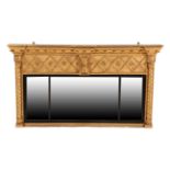 A Regency Gilt and Gesso Overmantel Mirror, early 19th century, of breakfront form with ball