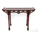 A Chinese Hardwood Altar Table, late 19th/early 20th century, of rectangular form with scrolled ends