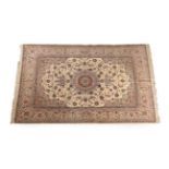 Fine Isfahan Carpet Central Iran, circa 1950 The ivory field of palmettes and vines centred by a