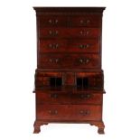 A George III Mahogany Secretaire Chest on Chest, late 18th century, the dentil cornice above a blind