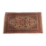 Finely Woven Isfahan Rug Central Iran, circa 1940 The cream field richly decorated with vines and