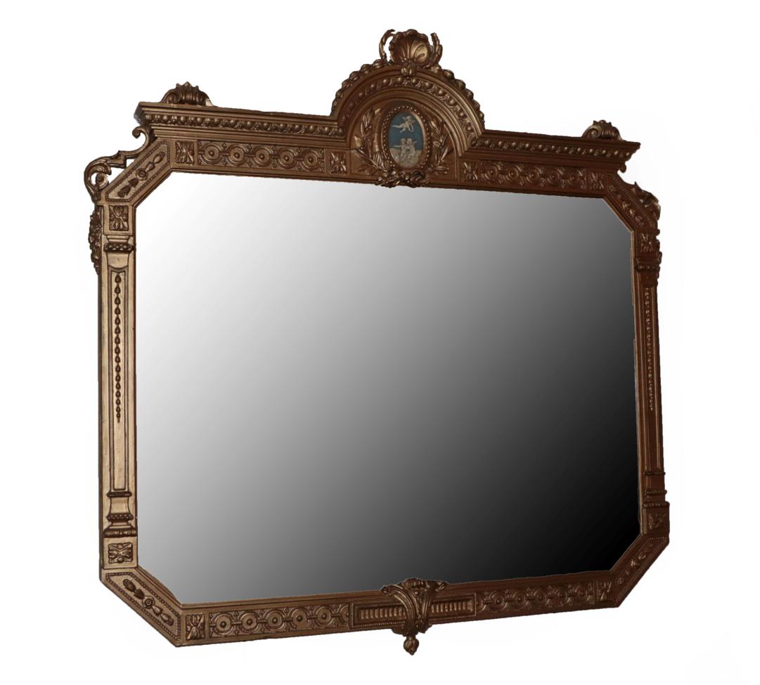 A Victorian Gilt and Gesso Overmantel Mirror, circa 1880, with original octagonal shaped mirror