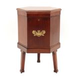 A George III Mahogany and Barber's Pole Strung Hexagonal Shaped Cellaret, the hinged lid above two