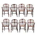A Matched Set of Eight Mid 19th Century Yewwood and Elm-Seated Windsor Armchairs, one stamped