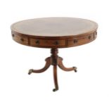 A Regency Rosewood Revolving Drum Table, early 19th century, the brown and gilt leather surface