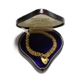 A fancy link bracelet with a 9 carat gold heart shaped padlock clasp, length 19.5cm (a.f.). Gross