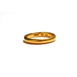 A 22 carat gold band ring, finger size L1/2. Gross weight 3.9 grams