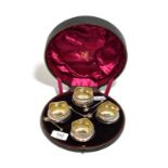 A cased set of four silver salts with salt spoons