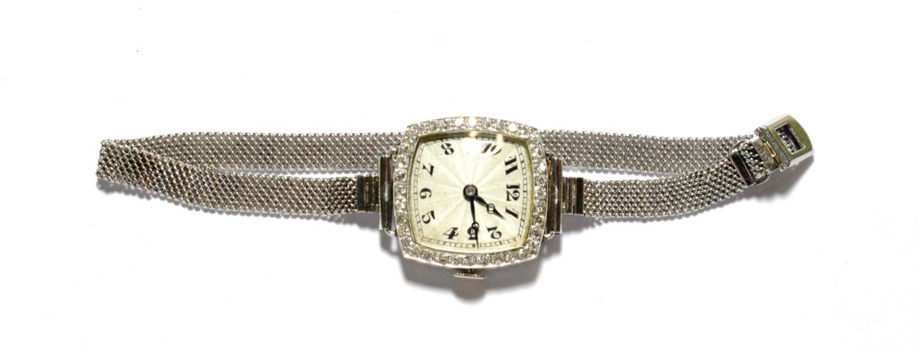 A lady's Art Deco diamond set wristwatch, inside case back inscribed 'ALL PLATINUM', with attached