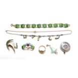 Seven pieces of enamelled jewellery including a bracelet enamelled in green tones, a locket