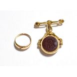 An 18 carat gold diamond ring, finger size I; and an 18 carat gold hardstone swivel fob brooch. Ring