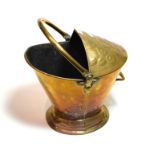 A 19th century brass helmet form coal scuttle